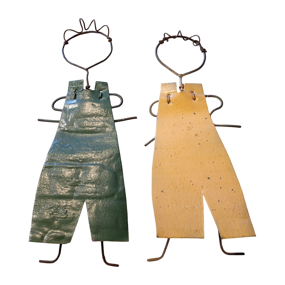 Collectible pair of folk art figures made from recycled and upcycled metal.